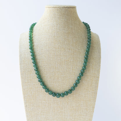 Rich green Emerald smooth round beads arranged in a 44cm necklace for handmade gemstone jewellery.