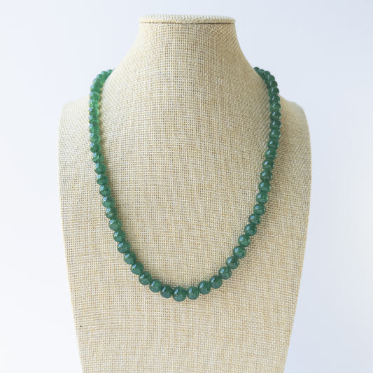 Rich green Emerald smooth round beads arranged in a 44cm necklace for handmade gemstone jewellery.