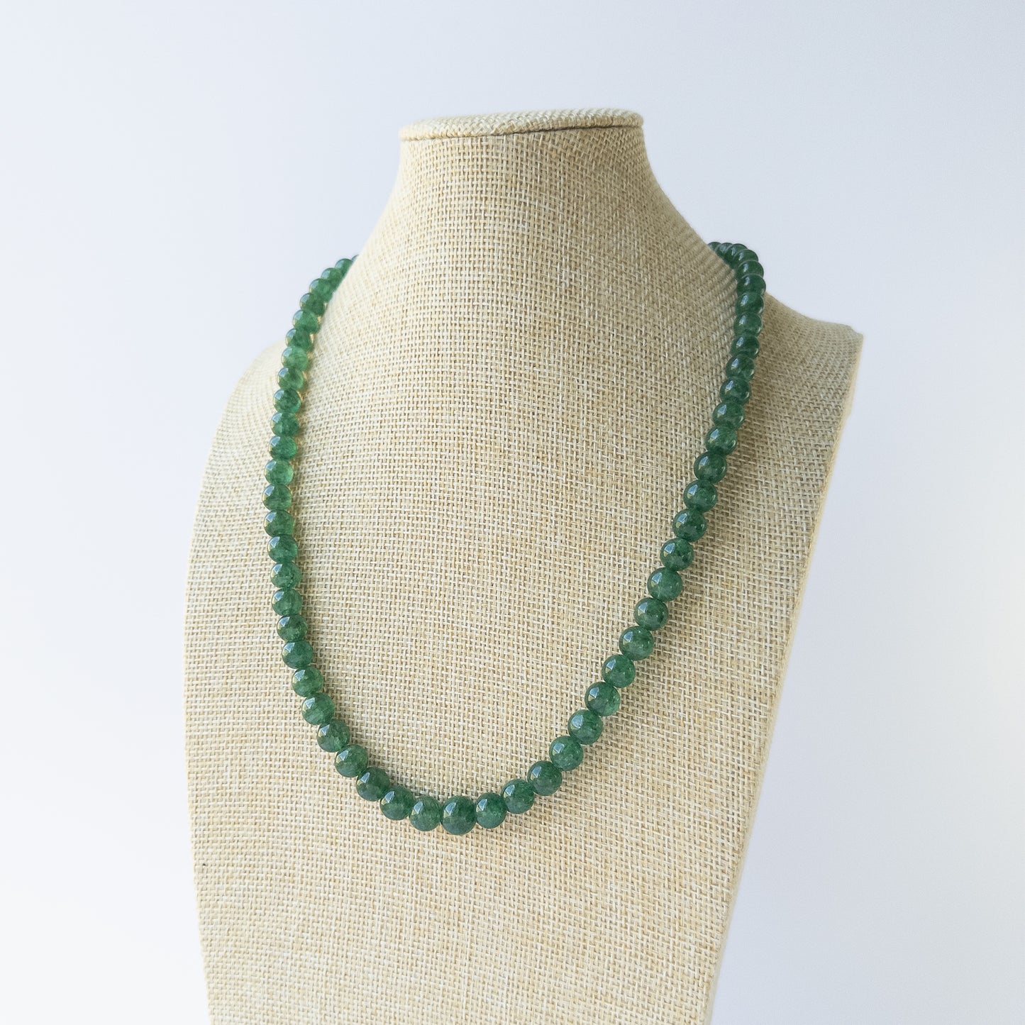 Genuine Emerald gemstone beads with polished smooth round shapes, ideal for DIY jewellery and artisan beadwork.