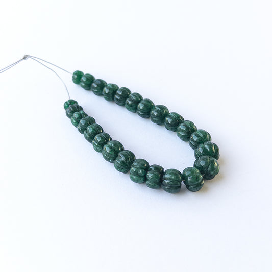 Emerald pumpkin‑cut gemstone beads in 6.8–10mm sizes, showcasing rich green colour for handmade jewellery designs.