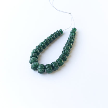 Genuine emerald stone beads with carved pumpkin cut, ideal for DIY jewellery and artisan gemstone beadwork.