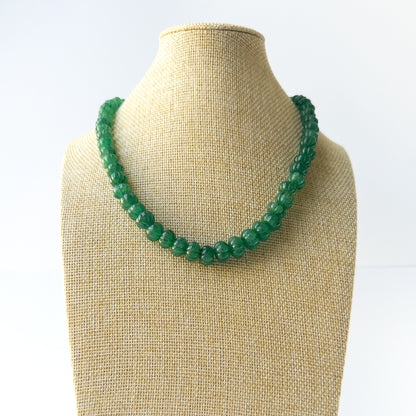 Genuine Emerald stone beads with sculpted pumpkin‑cut texture arranged in an elegant necklace.