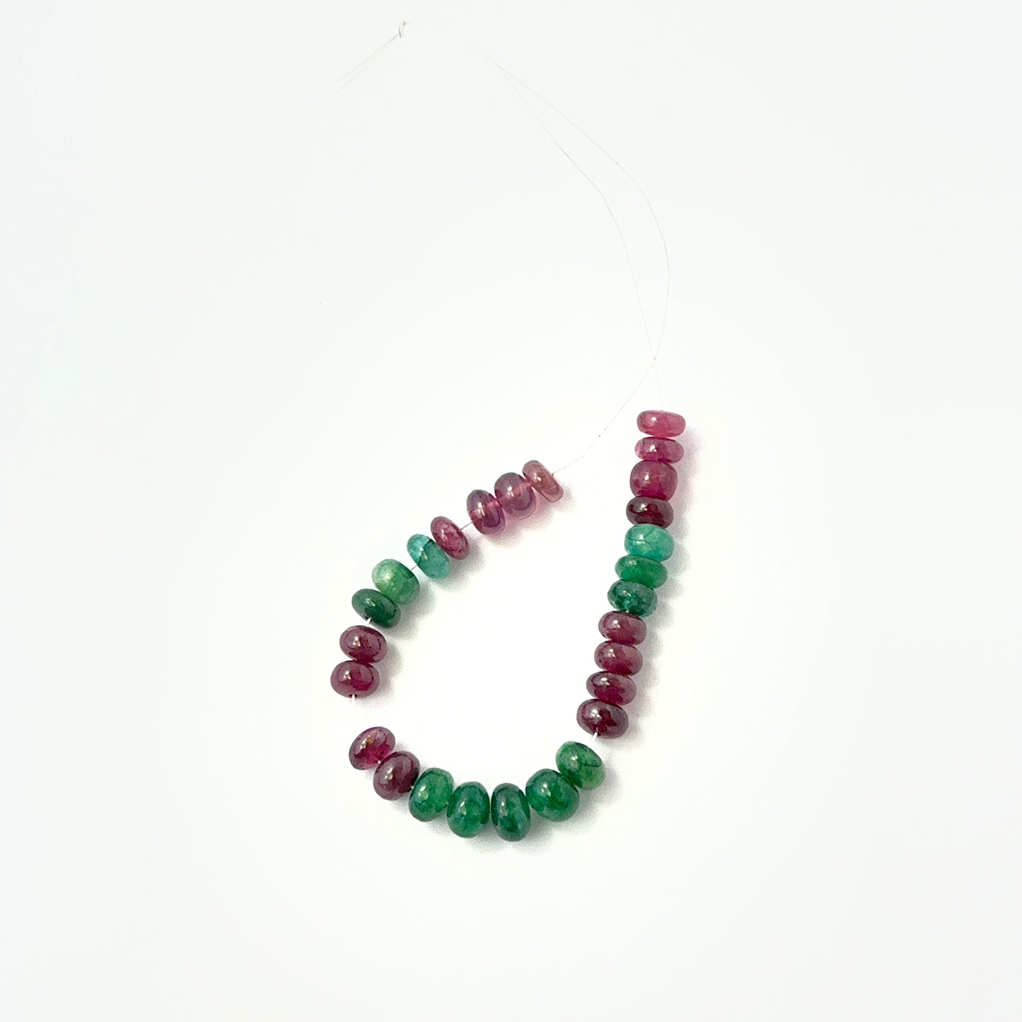 Emerald and Ruby smooth rondelle beads in rich green and red tones, ideal for genuine gemstone beads in DIY jewellery.