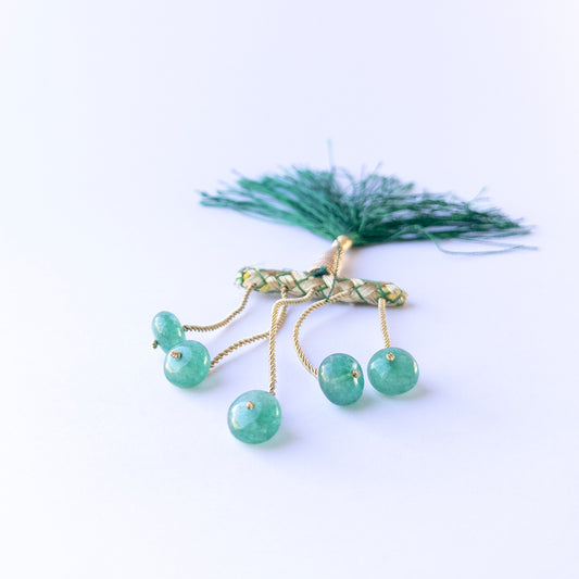 Emerald smooth rondelle beads in 10–10.7mm size arranged in a small set, showing rich green tones for handmade jewellery components.
