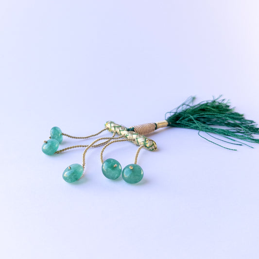 Close‑up of genuine emerald smooth rondelle gemstone beads with natural colour for DIY jewellery making.