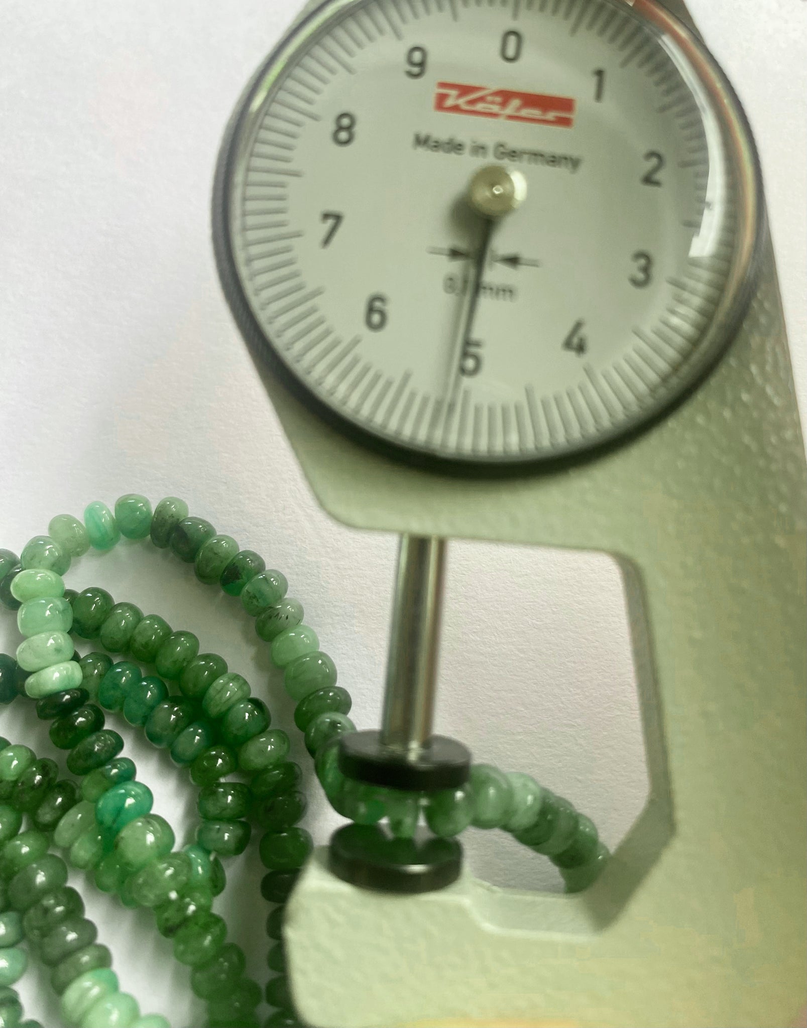High-quality emerald beads with a glossy surface and consistent shape, perfect for elegant designs.