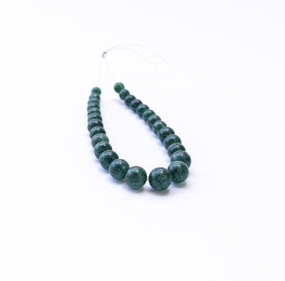 High‑quality Emerald round beads displaying bold colour and smooth finish.