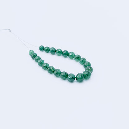 Genuine Emerald smooth round beads with deep green hues, ideal for handmade jewellery components.