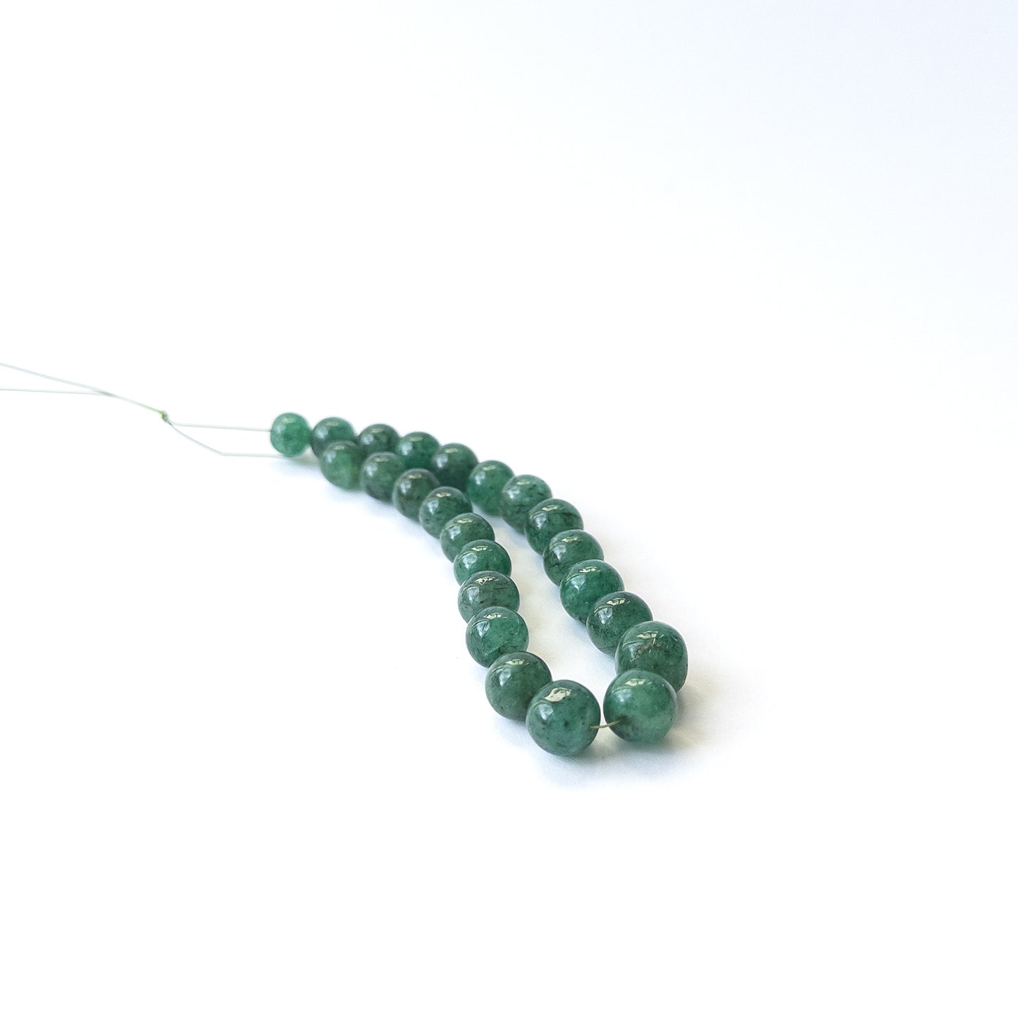 Authentic Emerald gemstone beads featuring polished smooth round cuts ideal for DIY jewellery making.