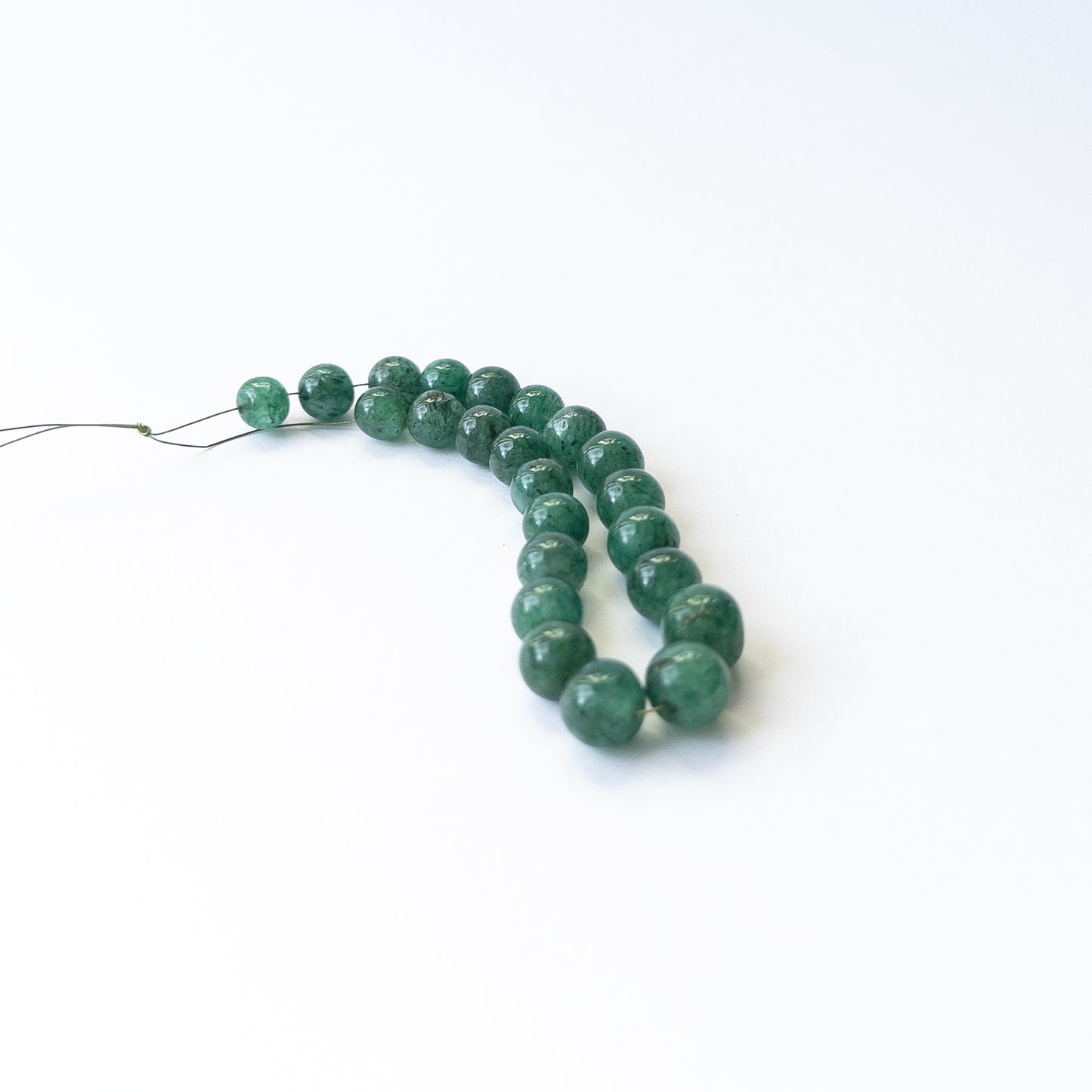 Handmade jewellery components using premium Emerald smooth rounds with soft shine and natural texture.