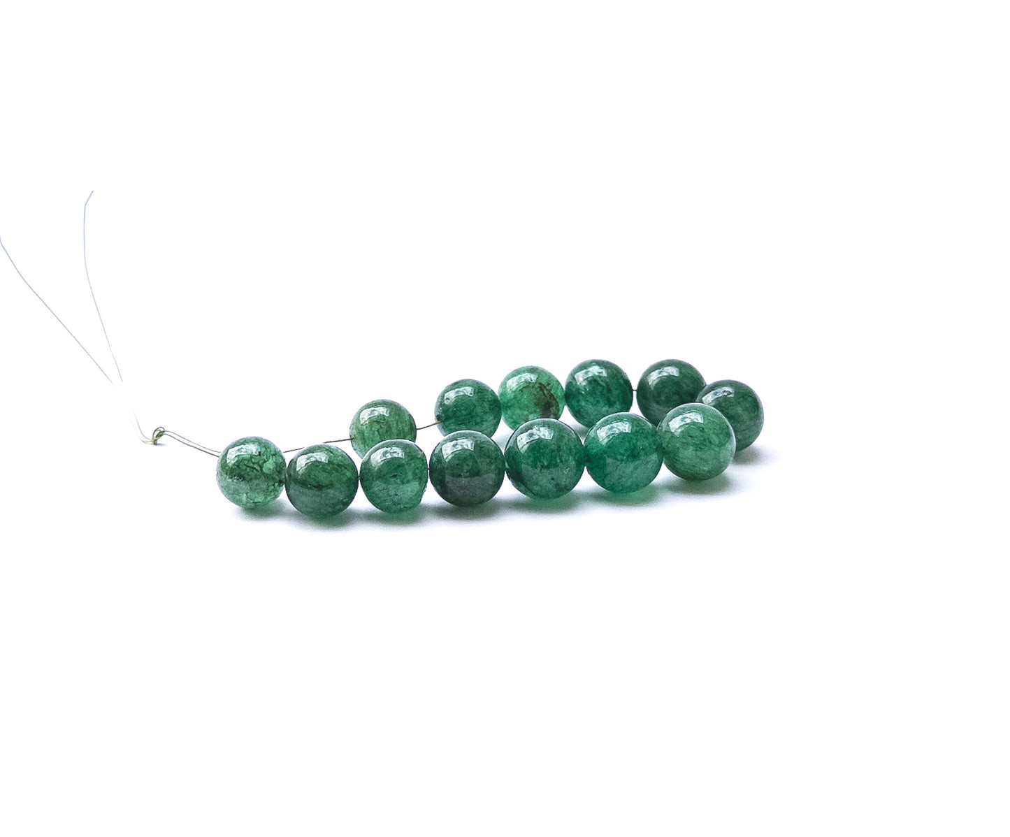 High‑quality Emerald round beads displaying bold colour and smooth finish.