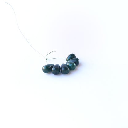 Authentic Emerald briolette beads with polished teardrop‑style shaping and natural colour variation.