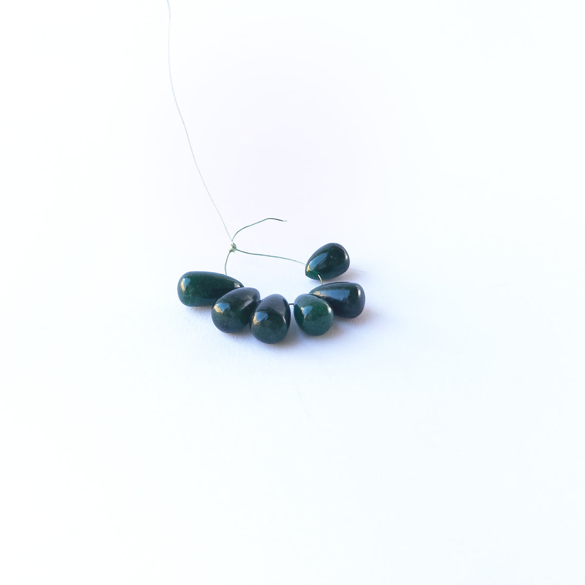 High‑quality Emerald beads neatly displayed for handmade jewellery components.