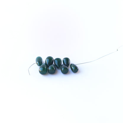 Smooth Emerald briolette beads with refined shaping and glossy finish.