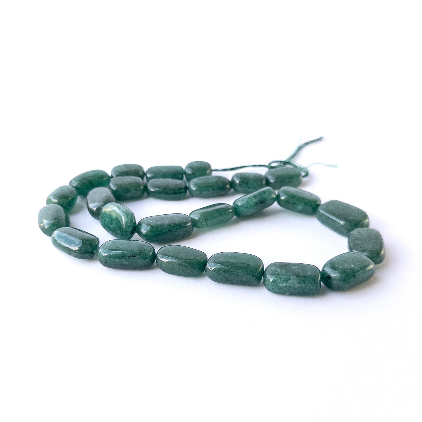 Genuine Emerald gemstone beads with polished tumble shapes, ideal for DIY jewellery and artisan beadwork.