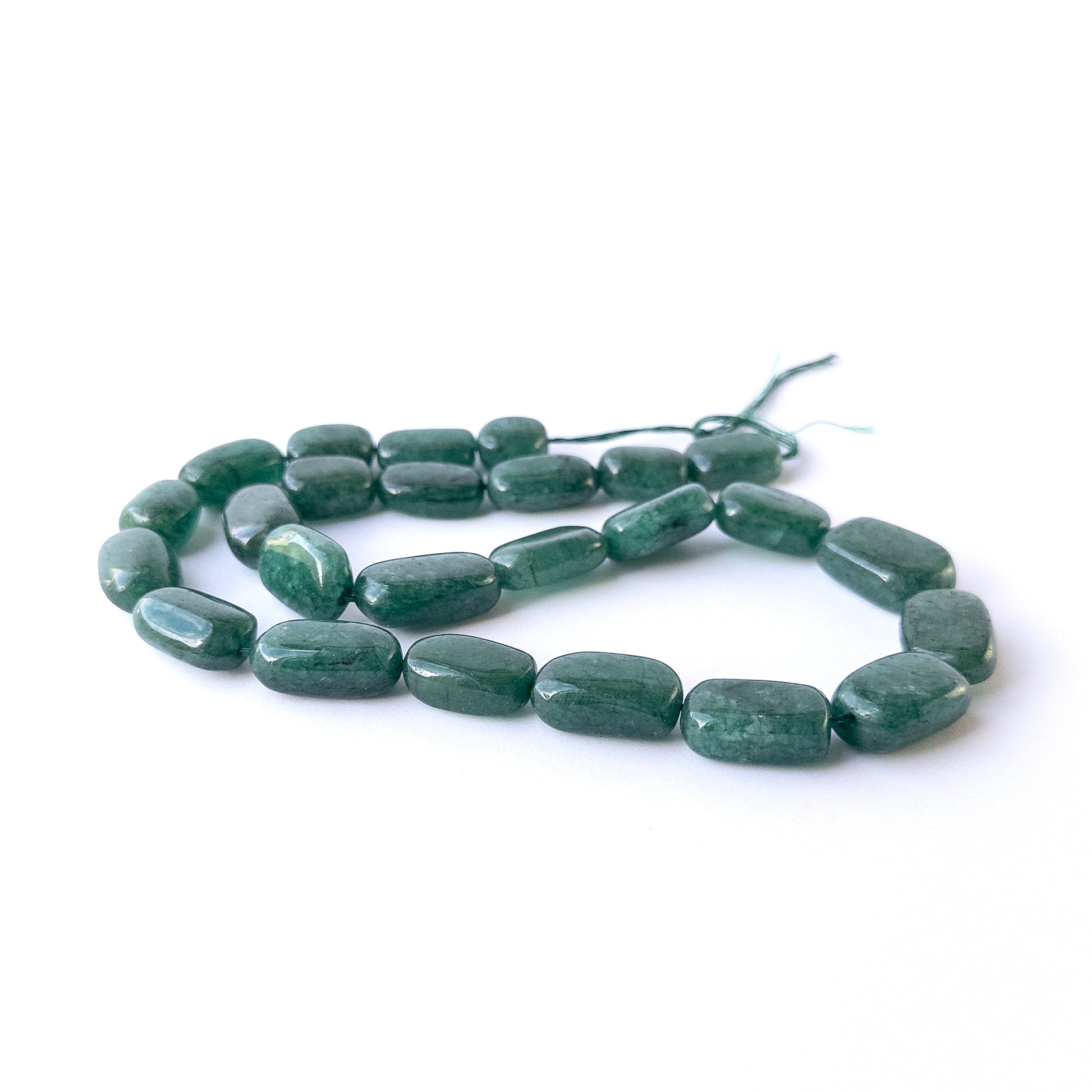 Genuine Emerald gemstone beads with polished tumble shapes, ideal for DIY jewellery and artisan beadwork.