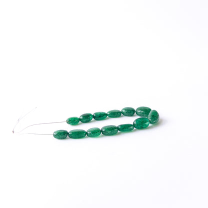 Smooth tumble Emerald beads in assorted 6.8–8.5mm sizes for artisan jewellery components.