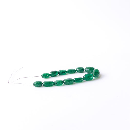 Smooth tumble Emerald beads in assorted 6.8–8.5mm sizes for artisan jewellery components.