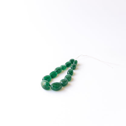 Handmade jewellery components featuring genuine Emerald tumble beads with vibrant natural green tones.