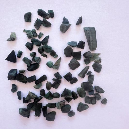 Emerald undrilled rough gemstones in 4–6.5mm size totalling 48 carats, ideal for custom jewellery or lapidary work.