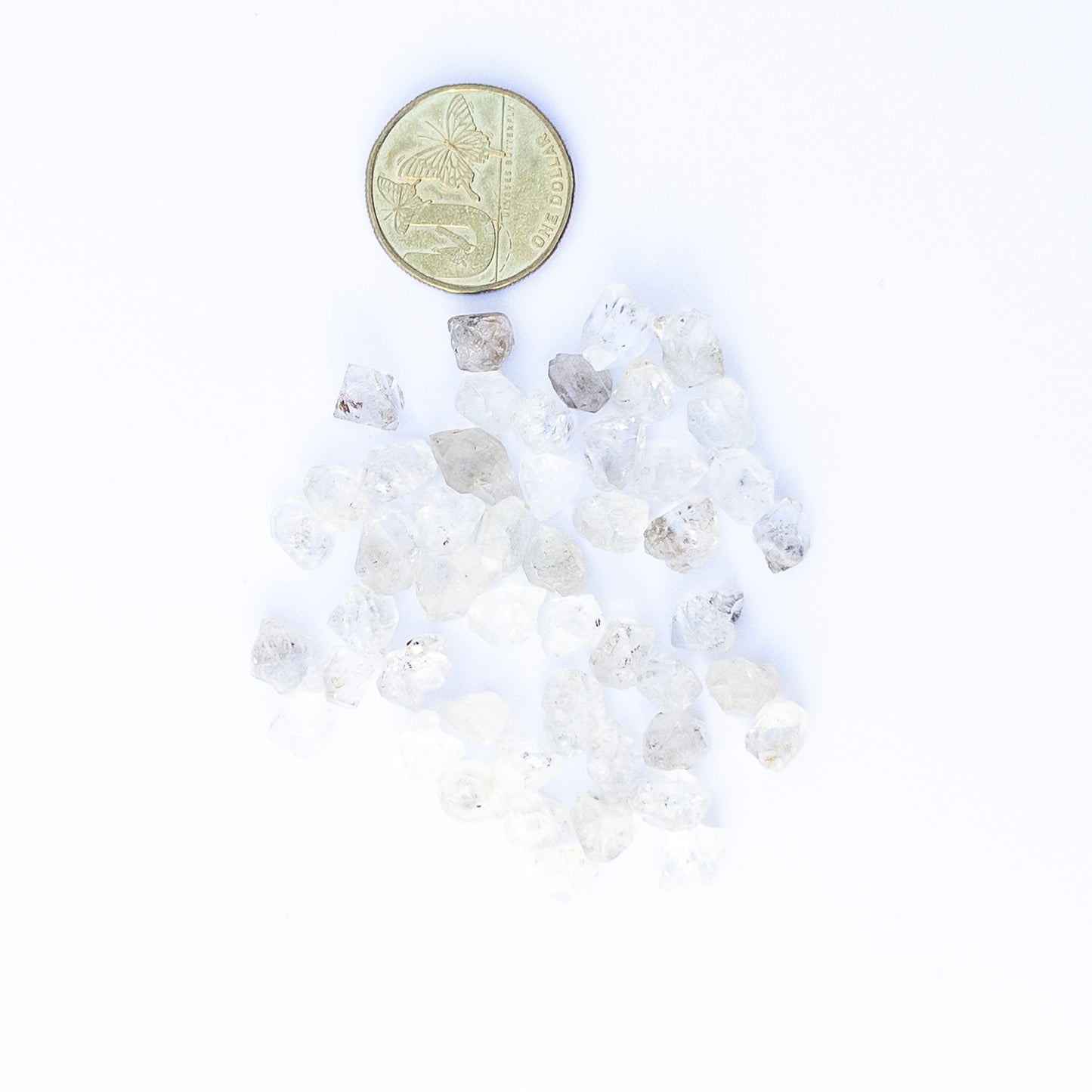 Close‑up of Herkimer Diamond rough gemstones highlighting their glass‑like clarity and sharp natural edges.