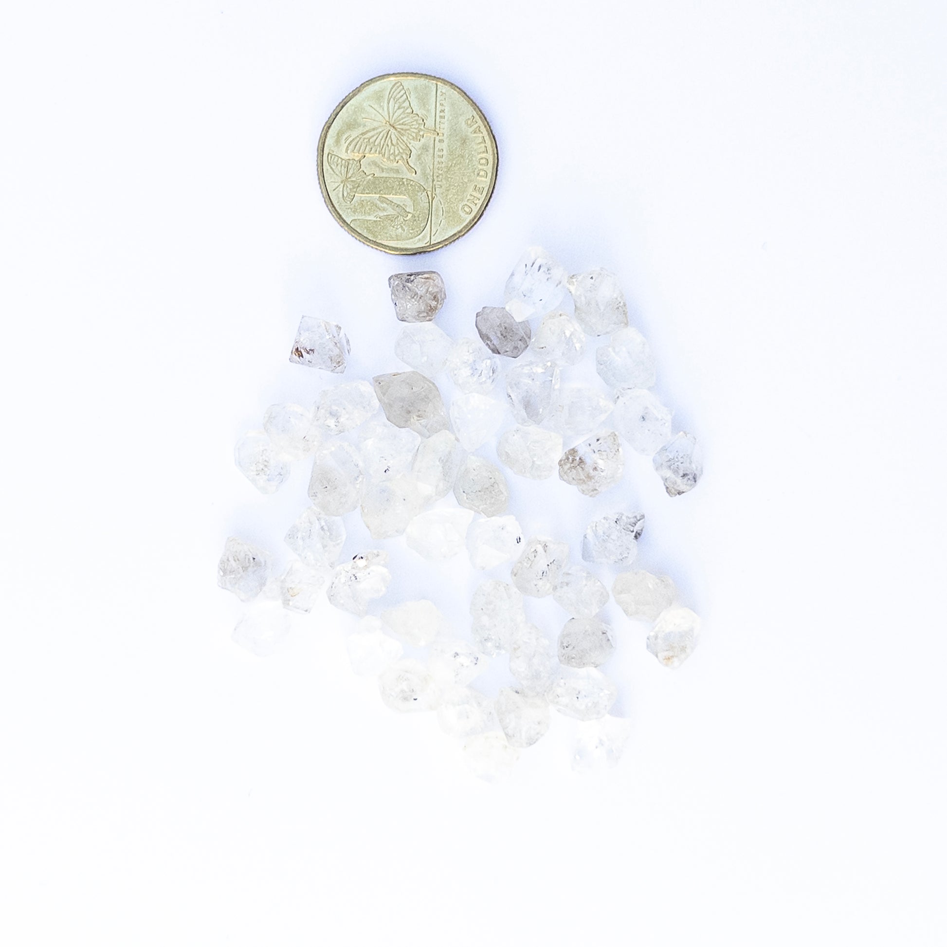Close‑up of Herkimer Diamond rough gemstones highlighting their glass‑like clarity and sharp natural edges.