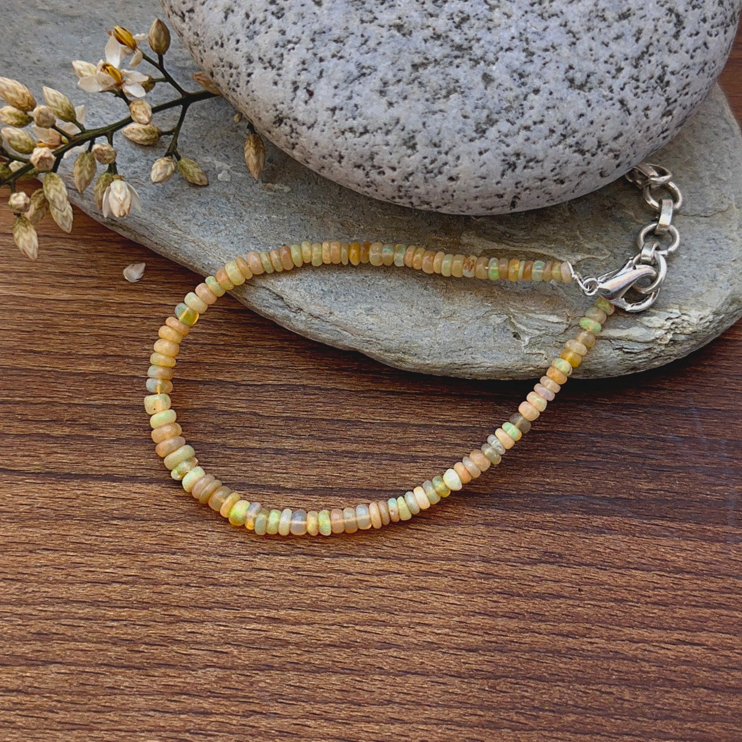 Ethiopian opal bracelet featuring smooth rondelle beads with soft play‑of‑colour.