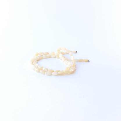 Genuine Ethiopian Opal gemstone beads with carved oval cut, perfect for artisan jewellery designs.
