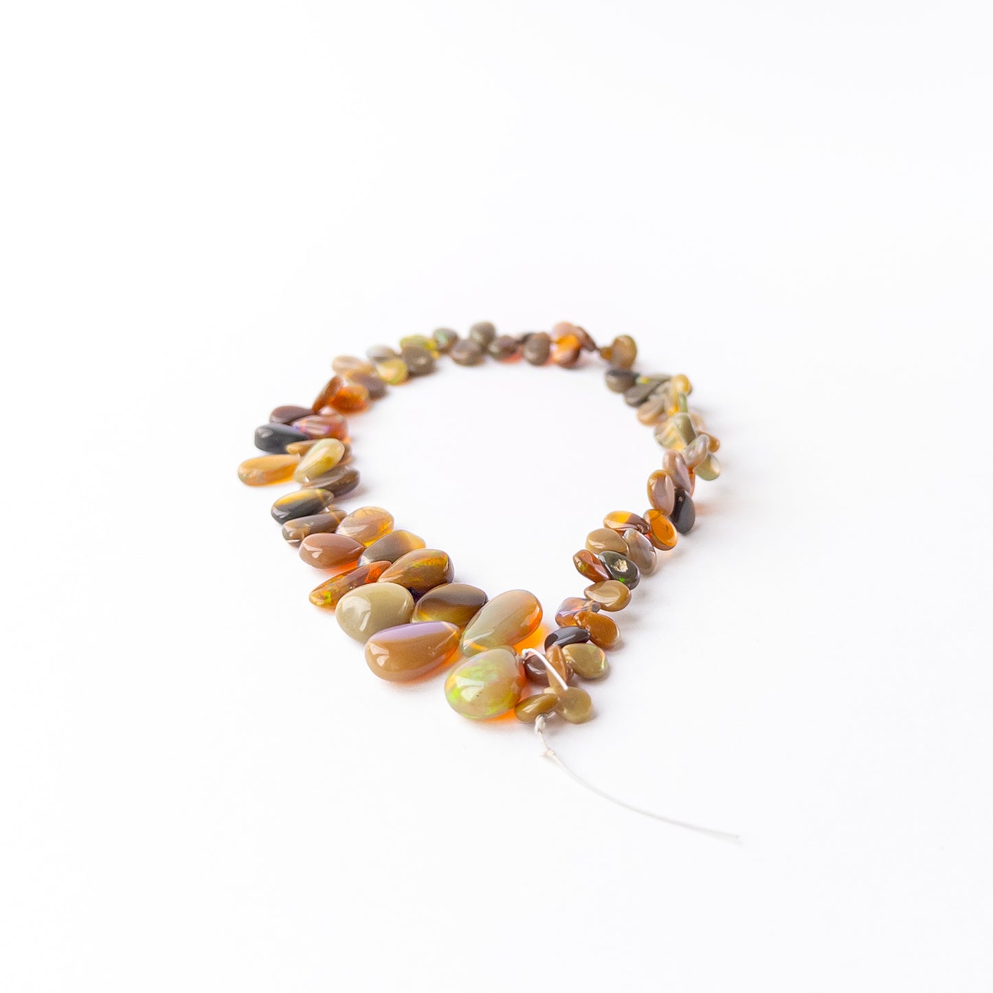 Genuine Ethiopian Opal gemstone beads with smooth briolette shape perfect for artisan jewellery.