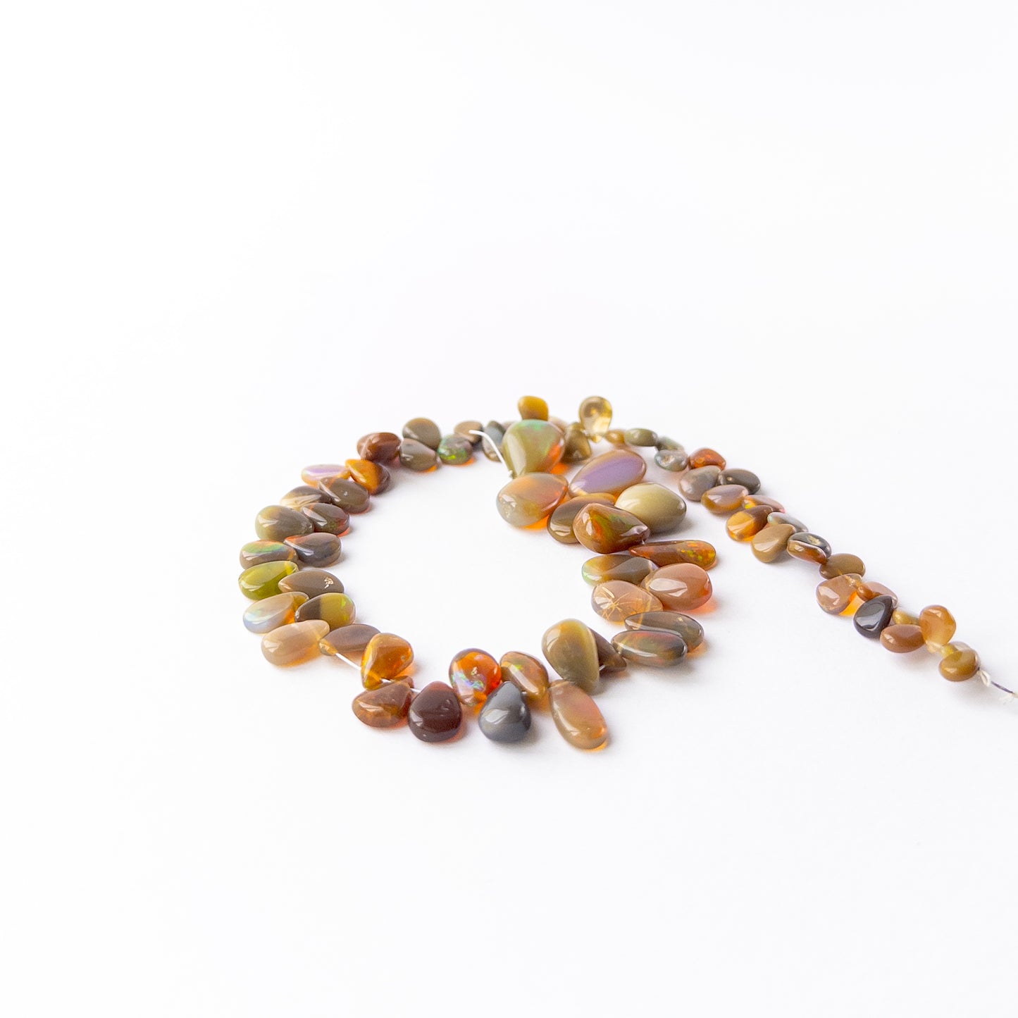 Handmade jewellery components featuring smooth Ethiopian Opal briolette gemstone beads.