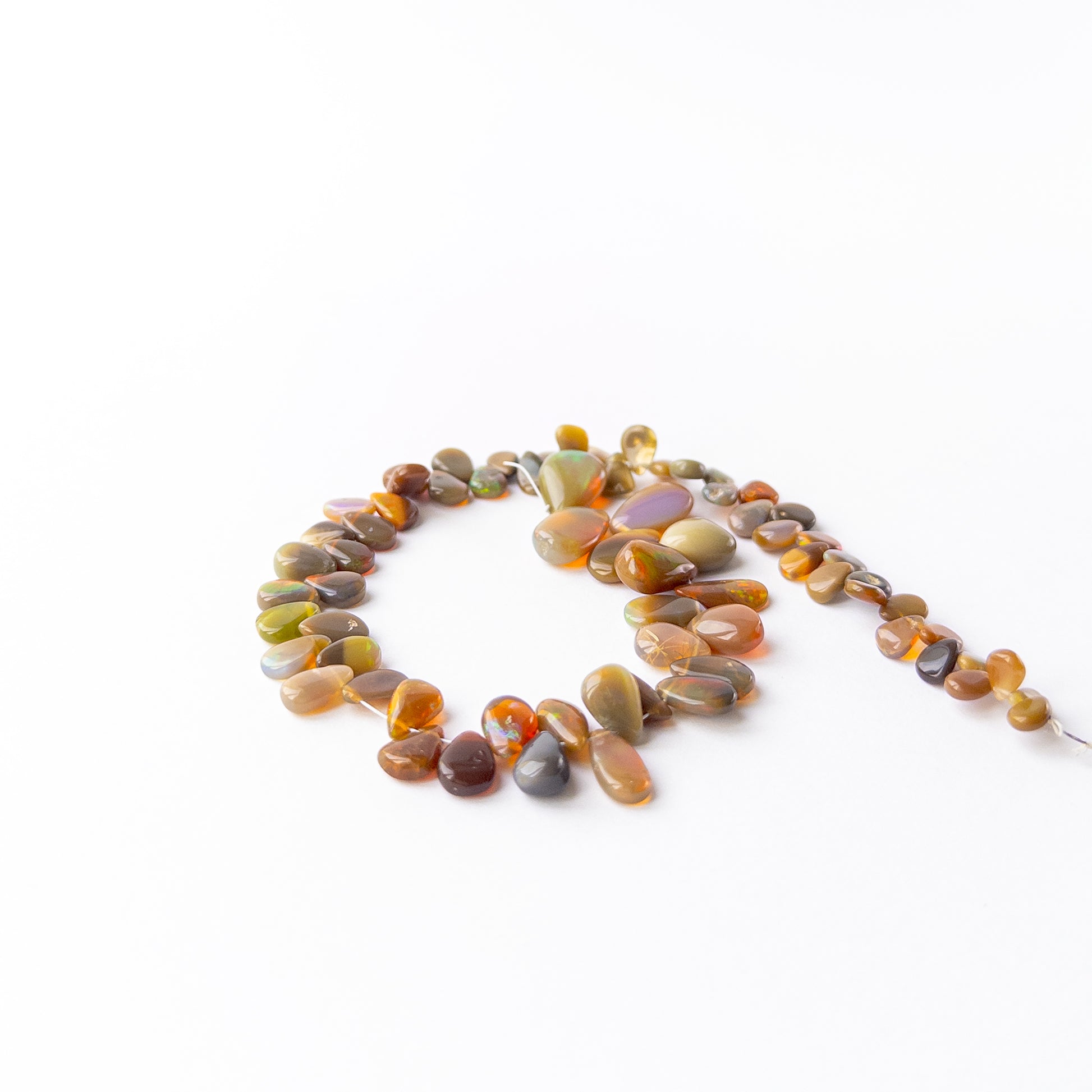 Handmade jewellery components featuring smooth Ethiopian Opal briolette gemstone beads.