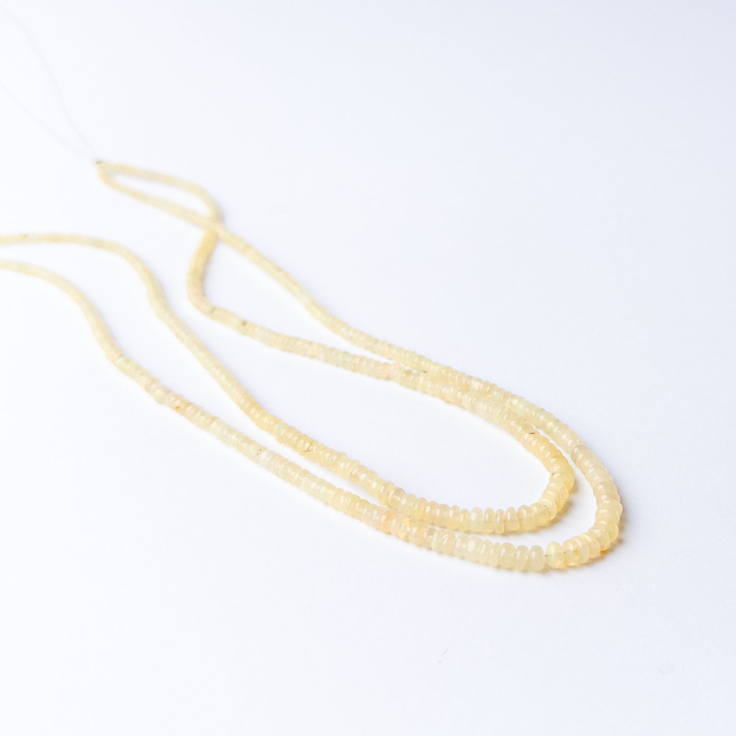 Genuine Ethiopian Opal gemstone beads showcasing polished shine and natural fire.