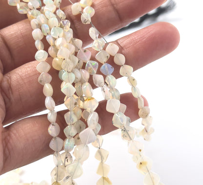 Ethopian Opal smooth rhombus gemstones with clean angular shaping and shifting pastel fire across a long 44cm strand.