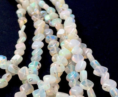 Ethopian Opal gemstones in smooth rhombus form, offering subtle translucence and lively colour play.