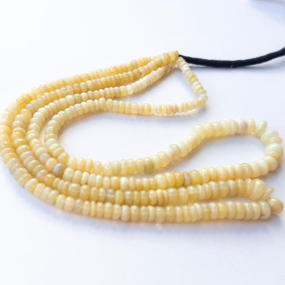 Ethopian Opal smooth wheel beads in 4.5–6.7mm, showing natural play‑of‑colour for genuine gemstone beads and handmade jewellery components.