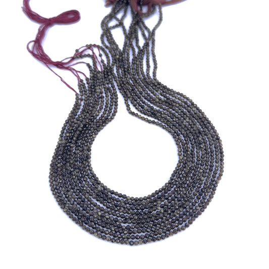 Cat’s Eye faceted rondelle gemstone beads arranged in a neat strand with subtle shimmer.