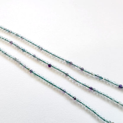Fluorite stone beads with precise faceted rondelle cut and premium polish.