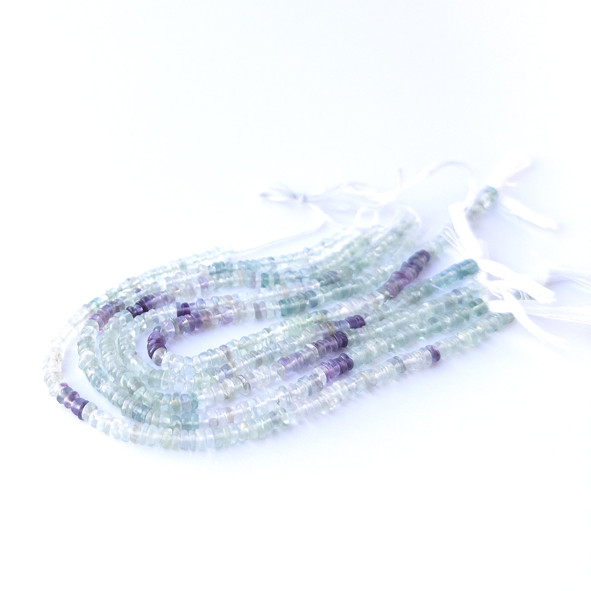 High‑quality fluorite wheel gemstone beads with natural banding and gentle polished shine.