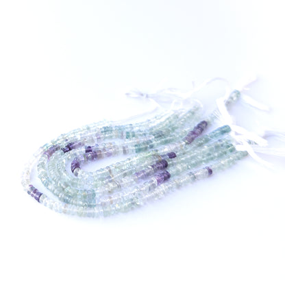 High‑quality fluorite wheel gemstone beads with natural banding and gentle polished shine.