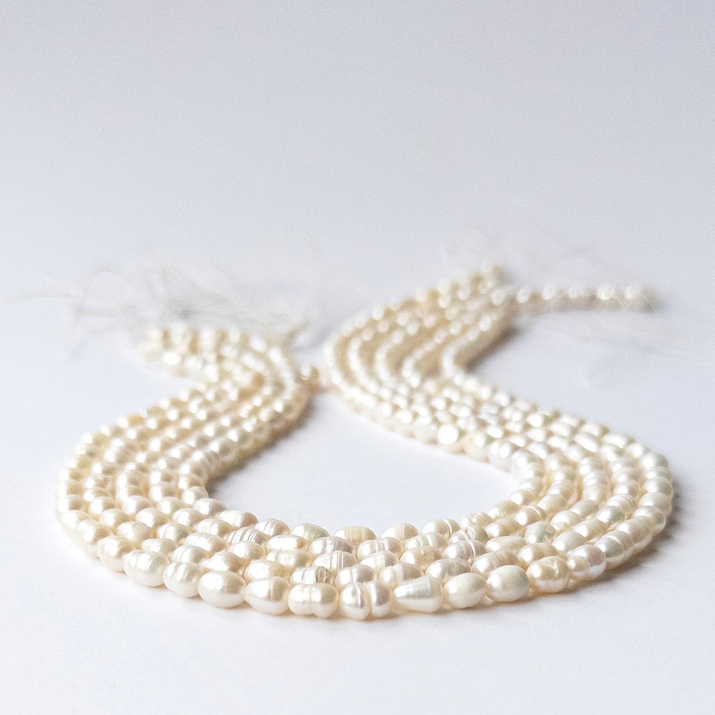 Close‑up of genuine Freshwater Baroque Pearl stone beads with polished surfaces and unique texture.