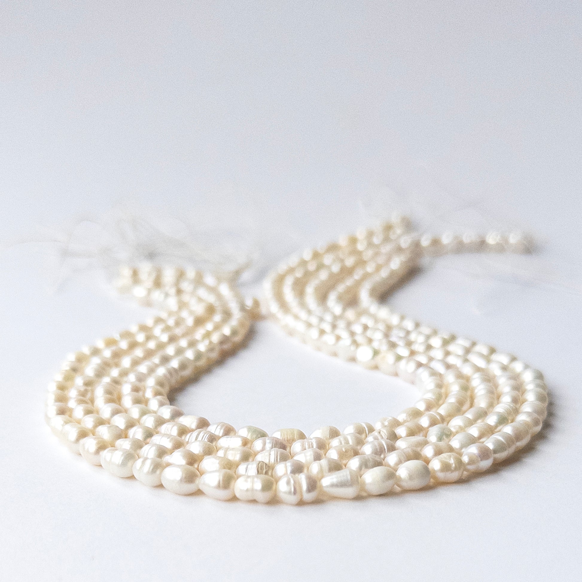Close‑up of genuine Freshwater Baroque Pearl stone beads with polished surfaces and unique texture.