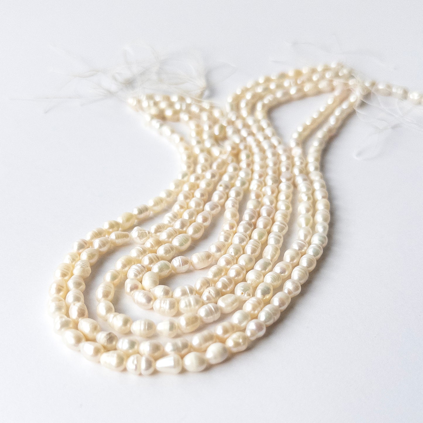 High‑quality Freshwater Baroque Pearls showcasing irregular shapes and elegant creamy glow.