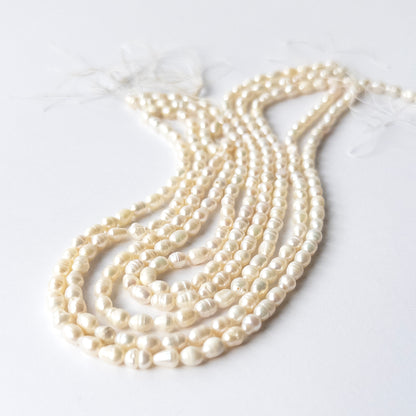 High‑quality Freshwater Baroque Pearls showcasing irregular shapes and elegant creamy glow.