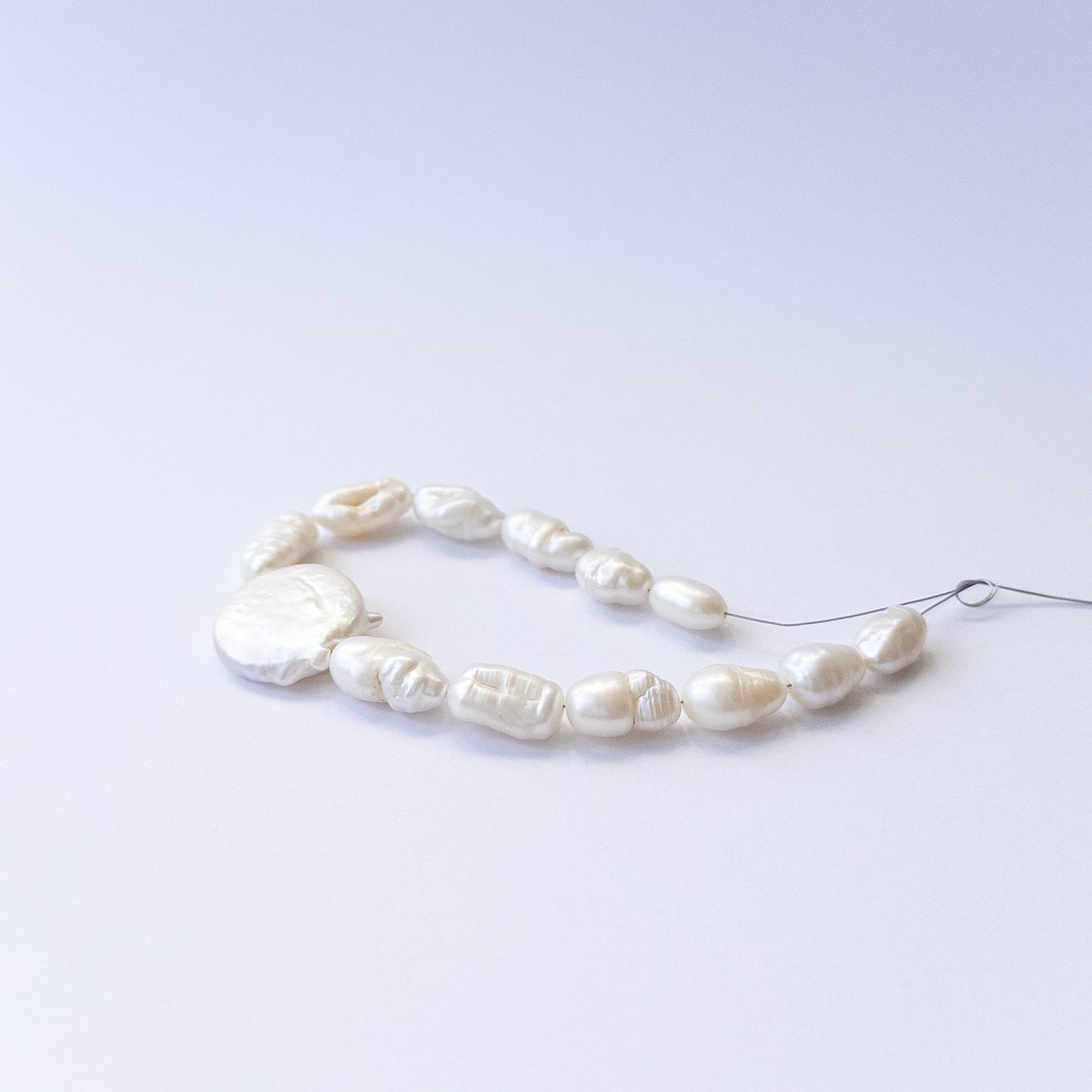 Genuine freshwater pearl beads showcasing mixed 6–9mm baroque shapes in 13‑piece sets.