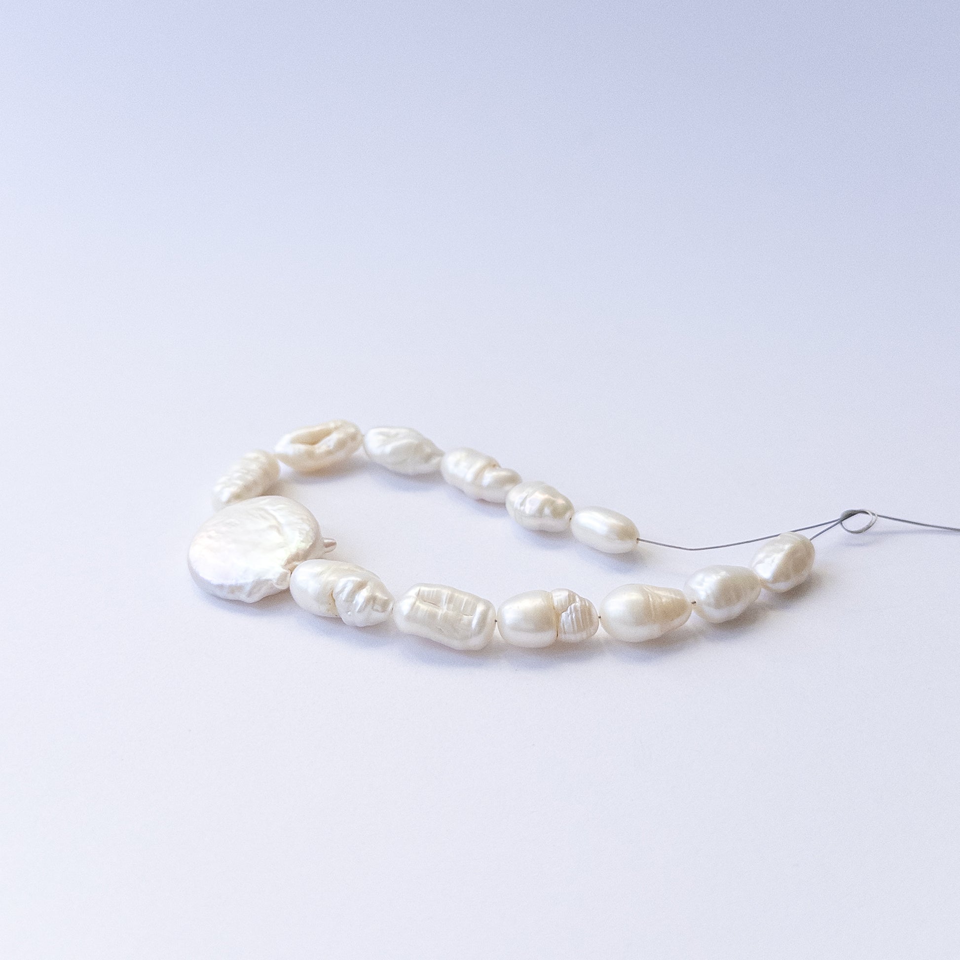 Genuine freshwater pearl beads showcasing mixed 6–9mm baroque shapes in 13‑piece sets.