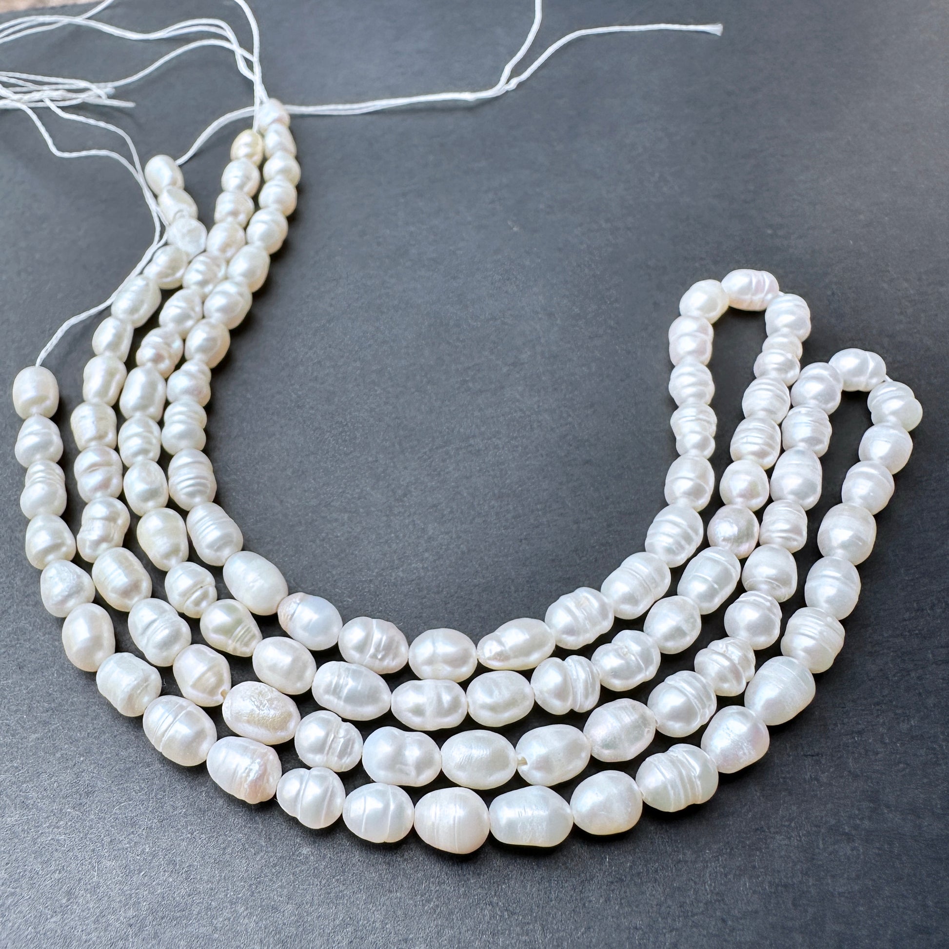 Natural pearls in baroque rice shape, 5.5-7mm length ‚àö√≥ 4.8-5.0mm breadth, ideal for elegant DIY jewellery designs.