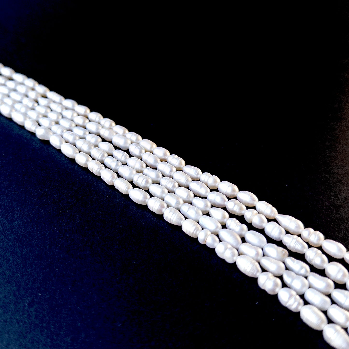 High‑quality freshwater baroque pearls with bright lustre and unique organic form on a long strand.