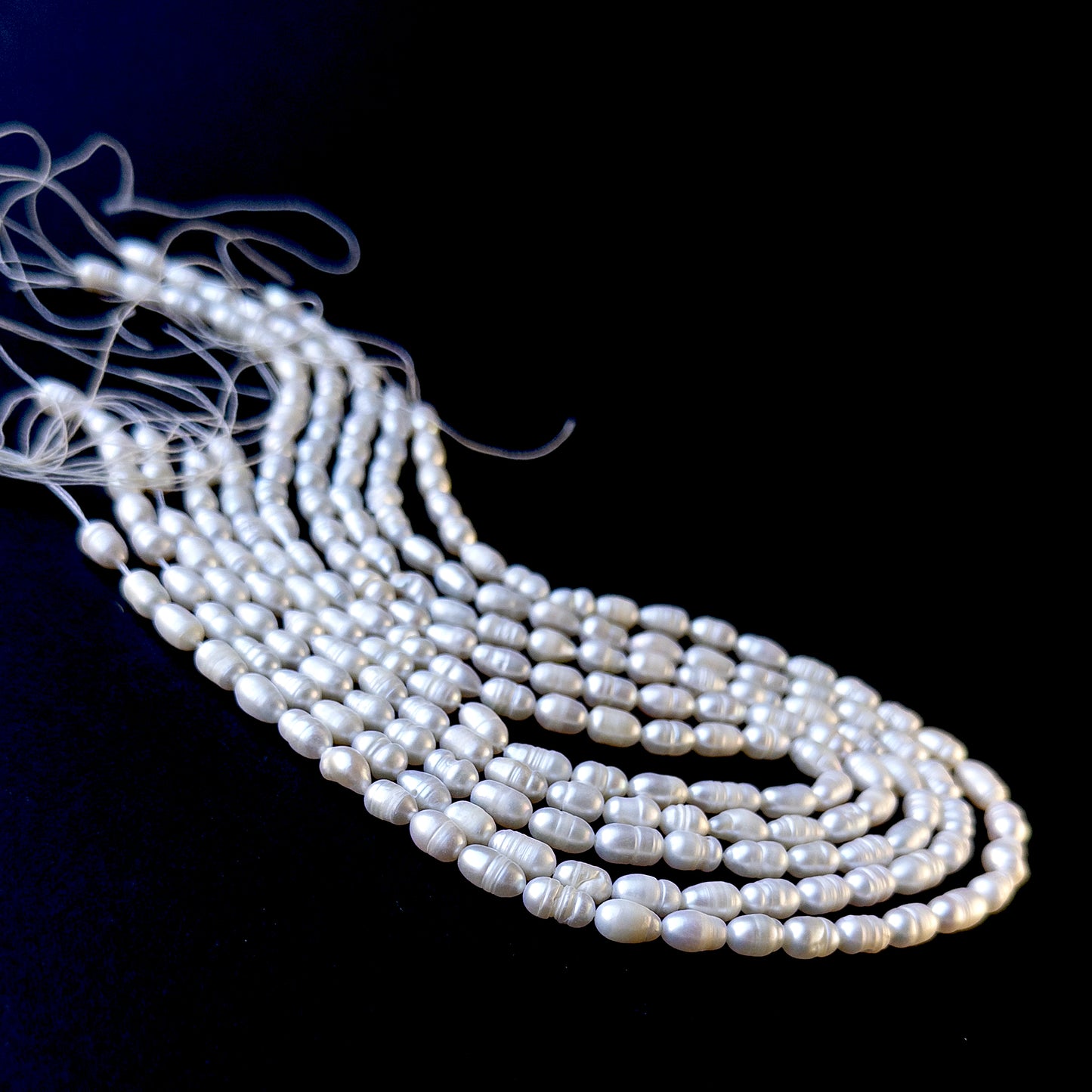 Authentic freshwater pearls with organic baroque rice shapes, ideal for handmade jewellery components.