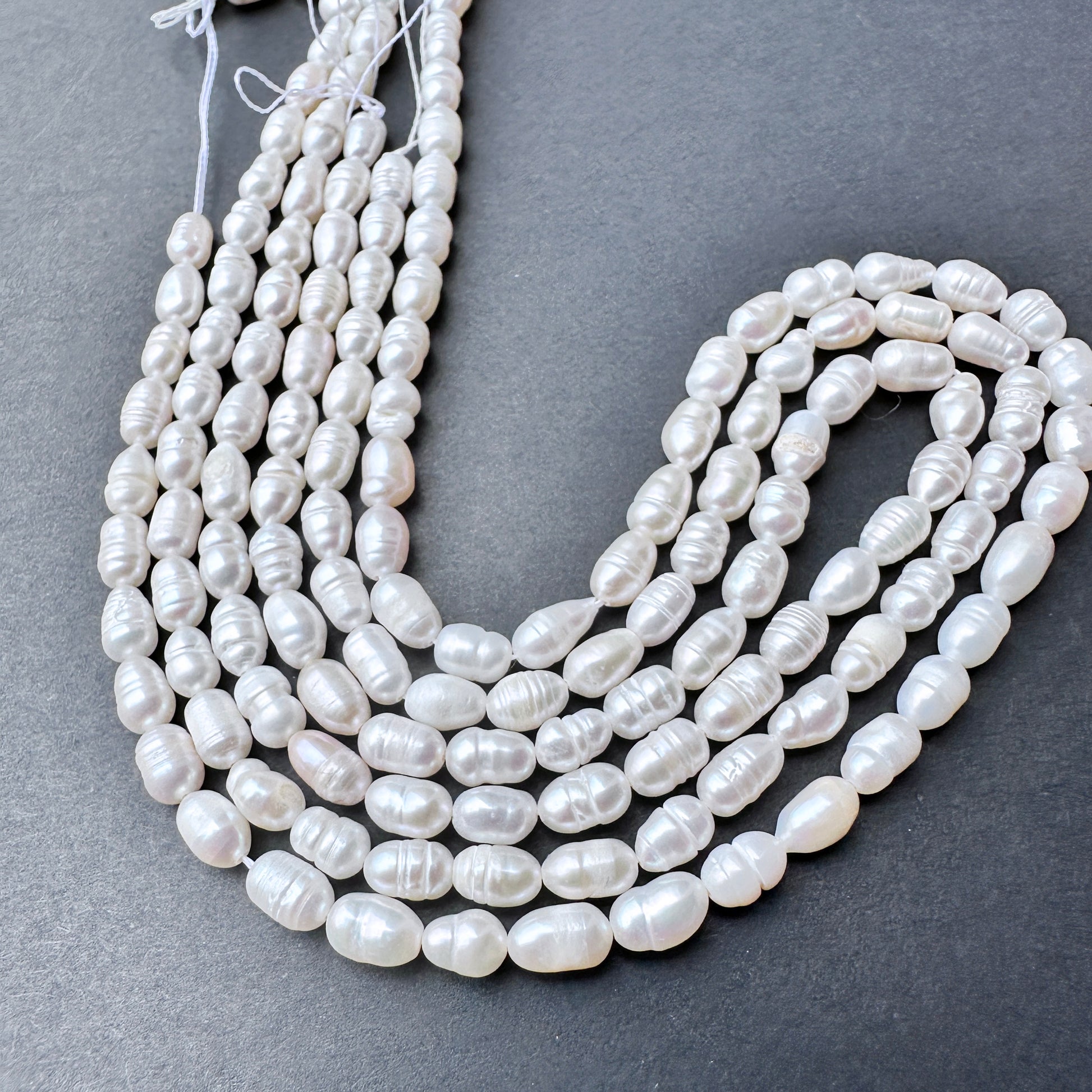 Natural pearls in baroque rice shape, 7-8mm length ‚àö√≥ 4.5-4.7mm breadth, ideal for elegant DIY jewellery designs.