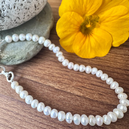 Elegant freshwater pearls bracelet crafted from natural gemstone beads, 4.5mm smooth rondelle cut, timeless jewellery design.